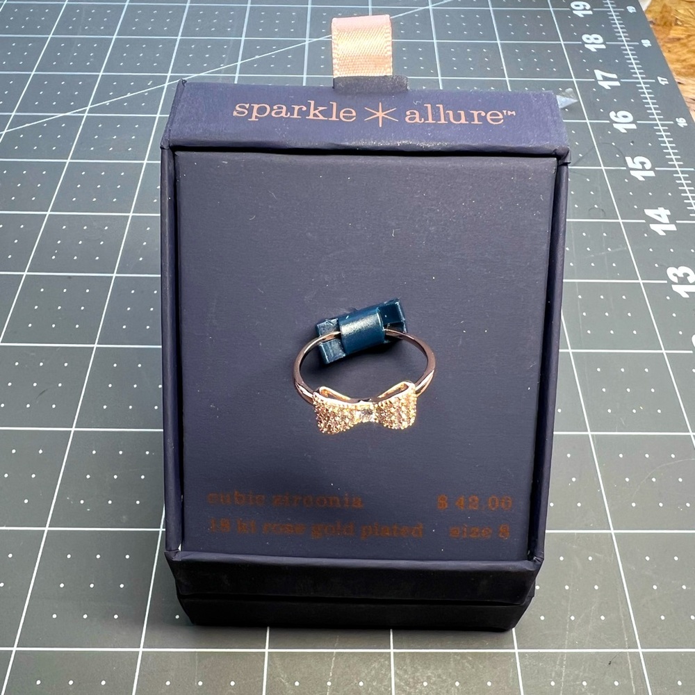 Sparkle & Allure rose gold bow tie ring w/ cubic zirconia stones - size 8